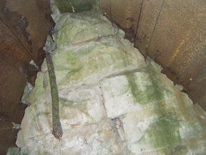 The inside of stone roof lined with rusty metal